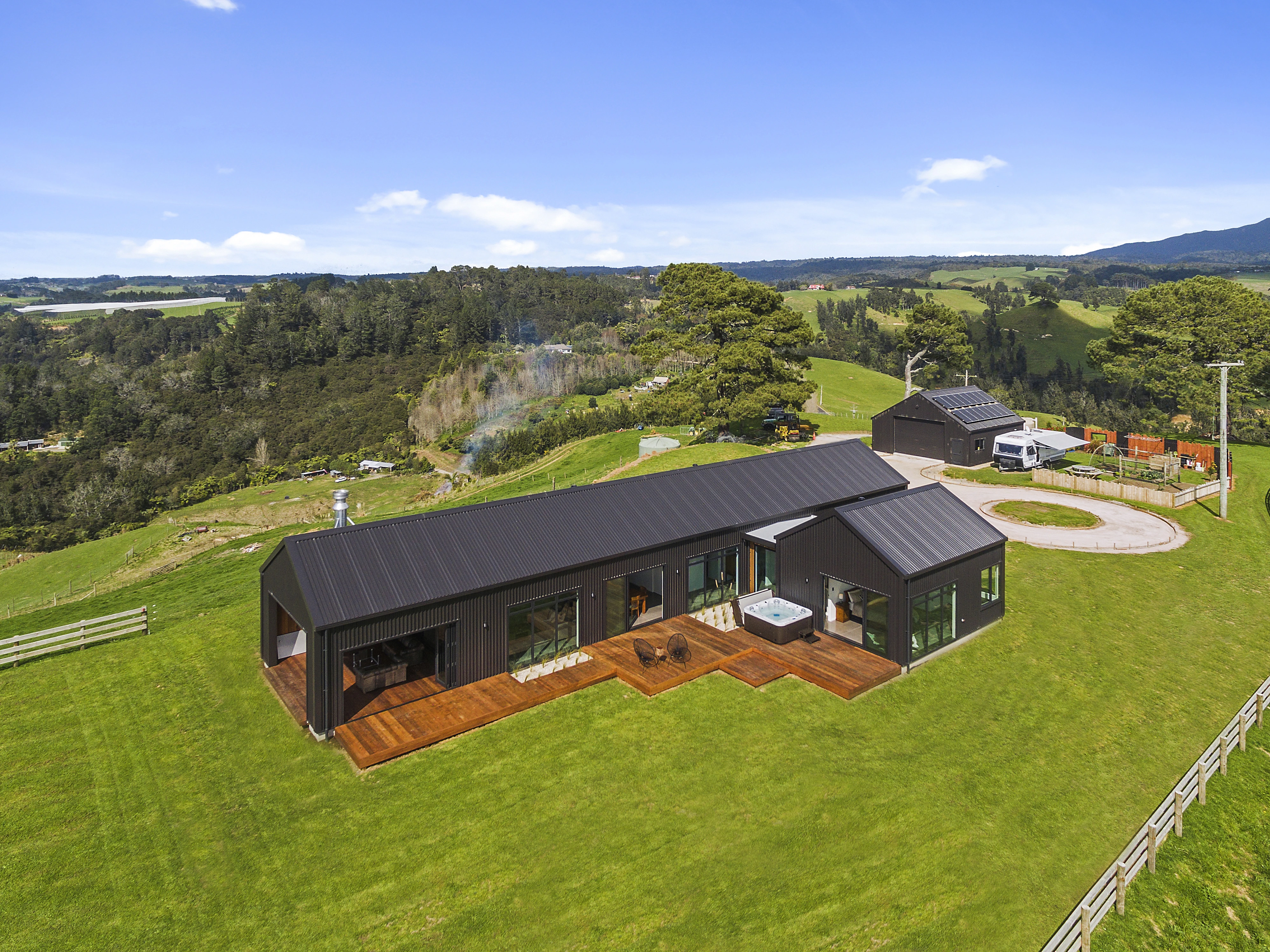 House built in iron clad standing at the middle of a green meadow