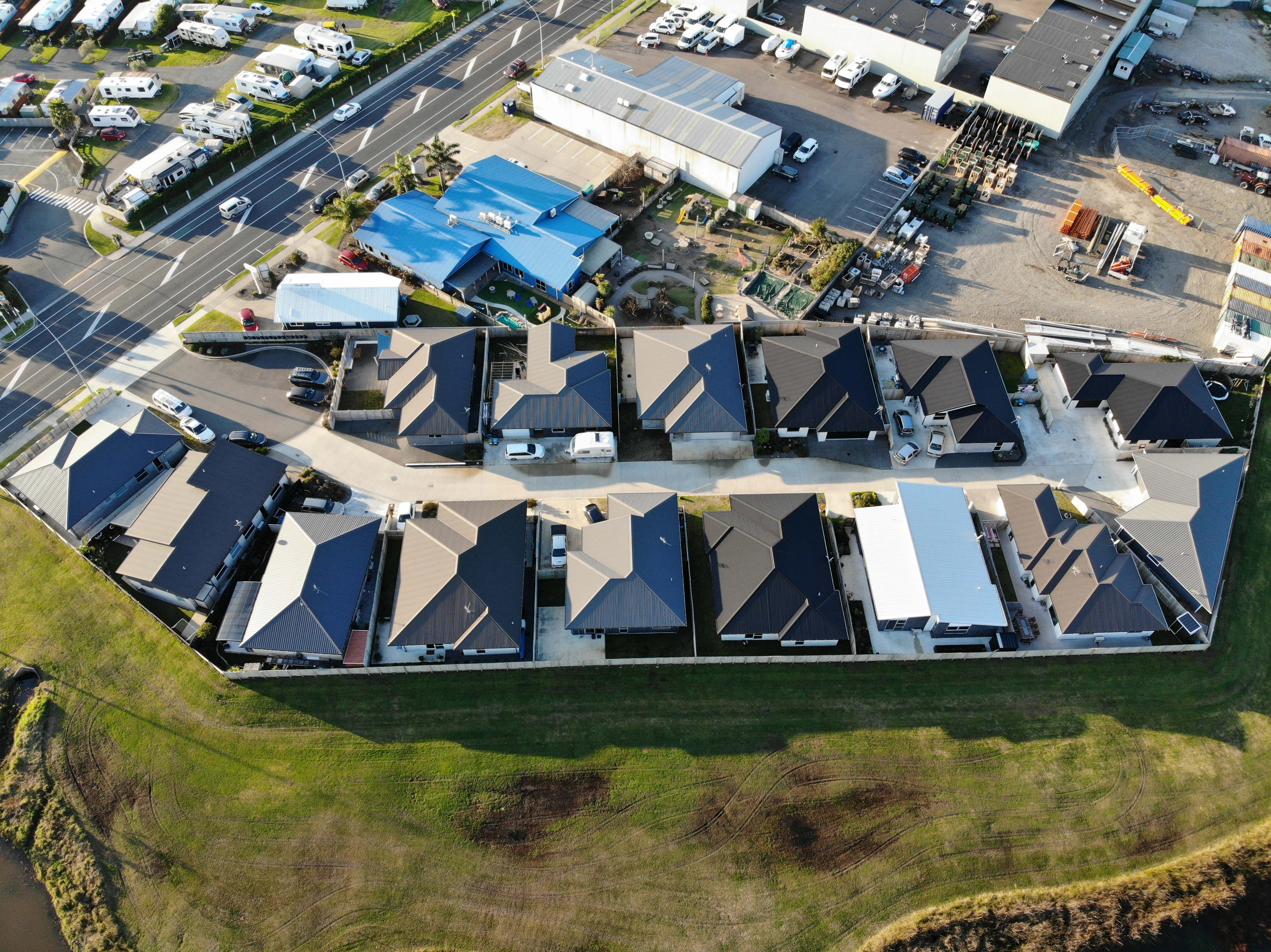 Aerial view of modern houses, each with a new roof