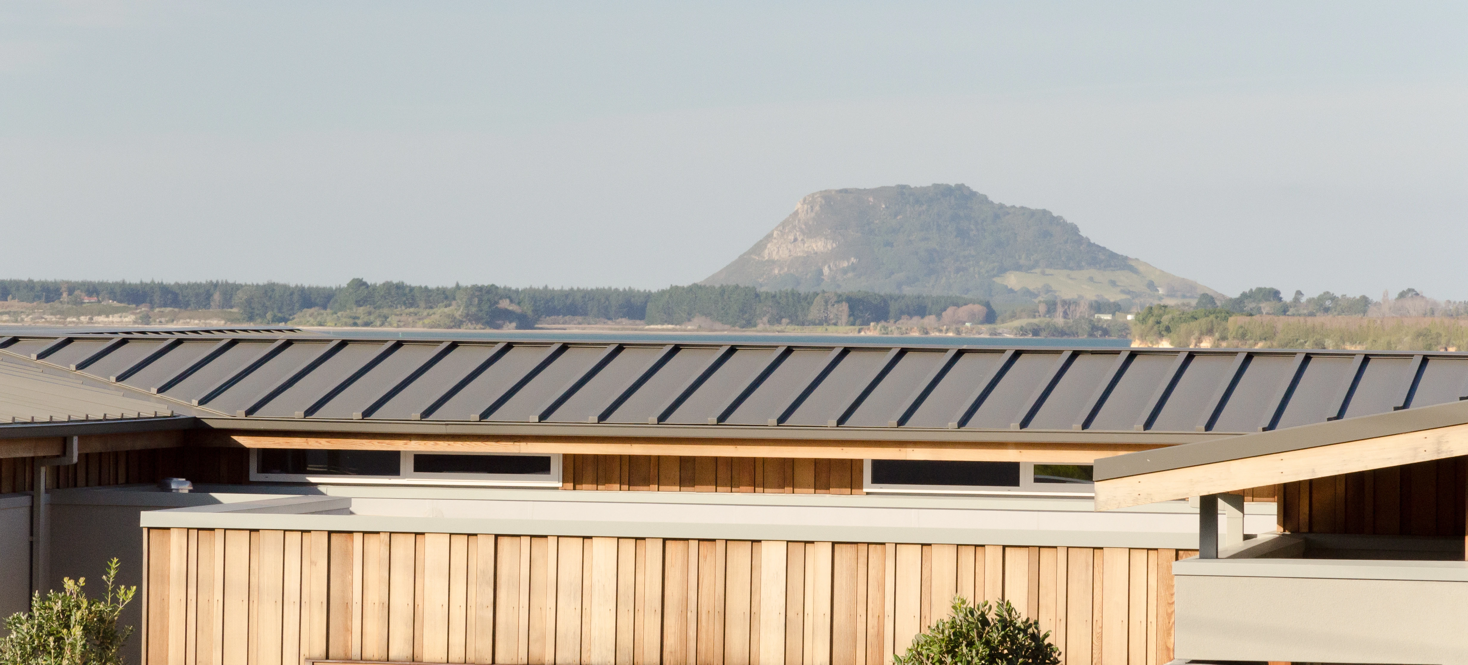 a house roof after re roofing work has been undertaken and a view of the mountain