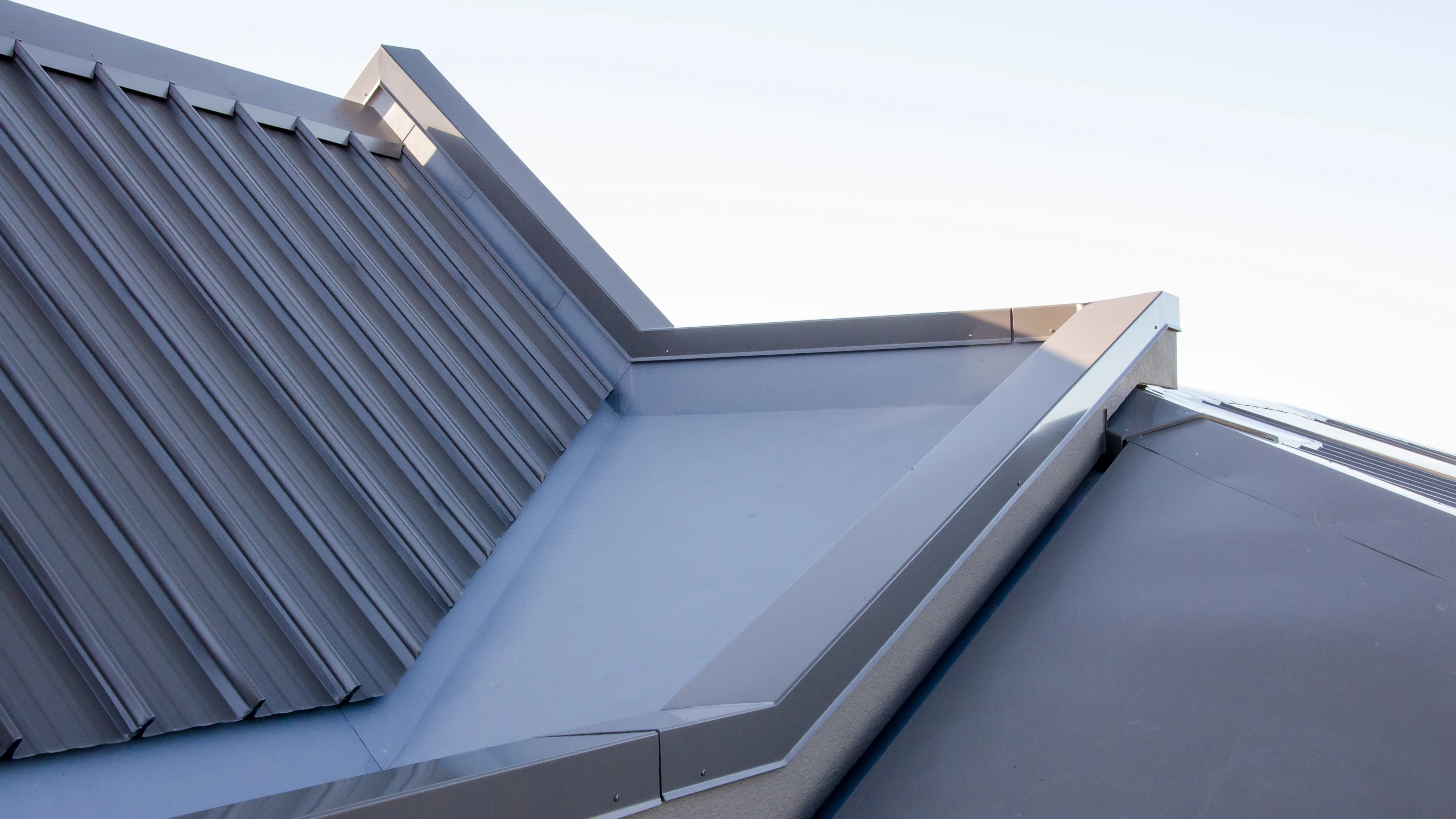 A close up view of part of a new roof on a home