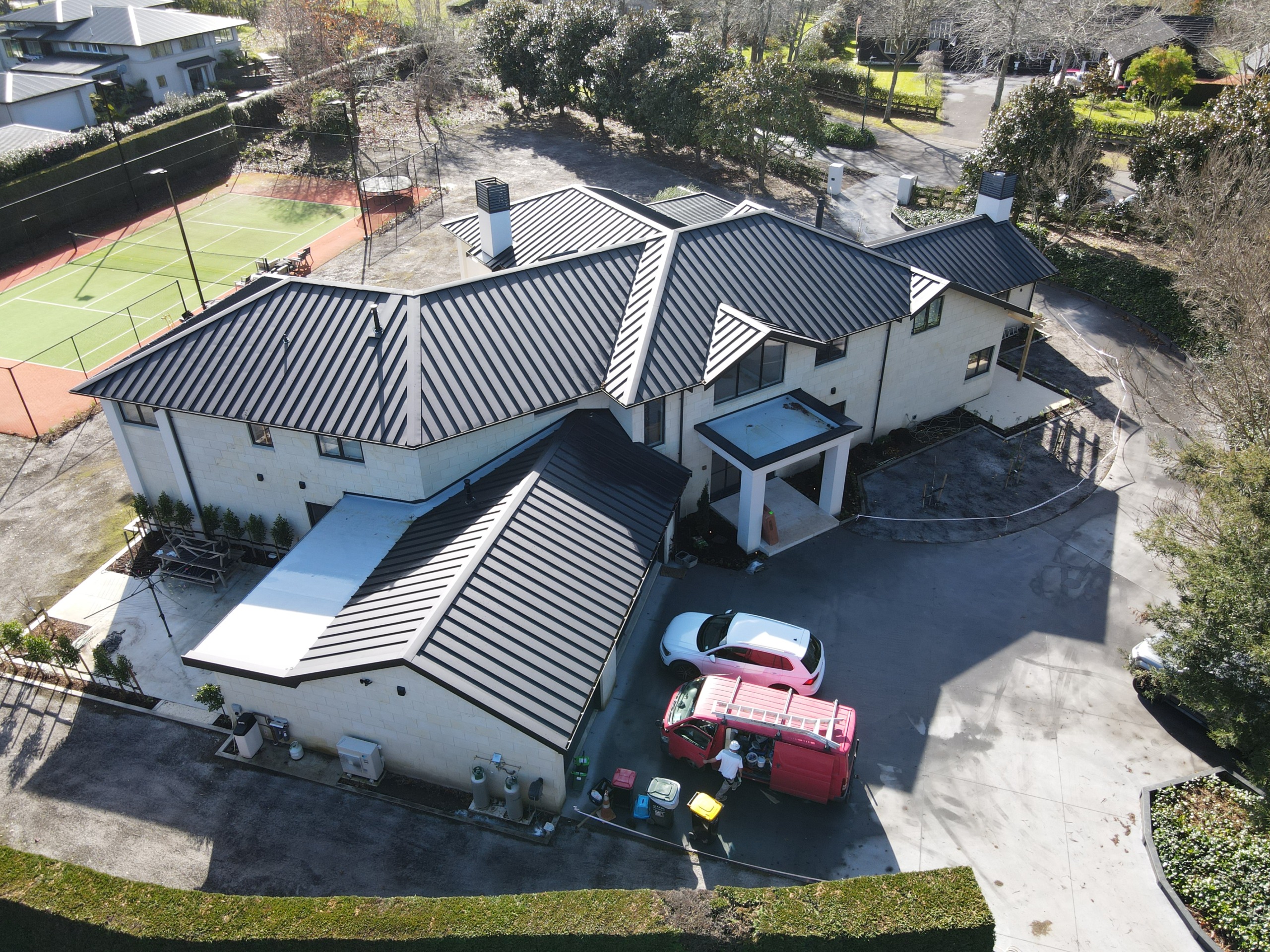 Newly installed long run metal roofing for a large residential property.