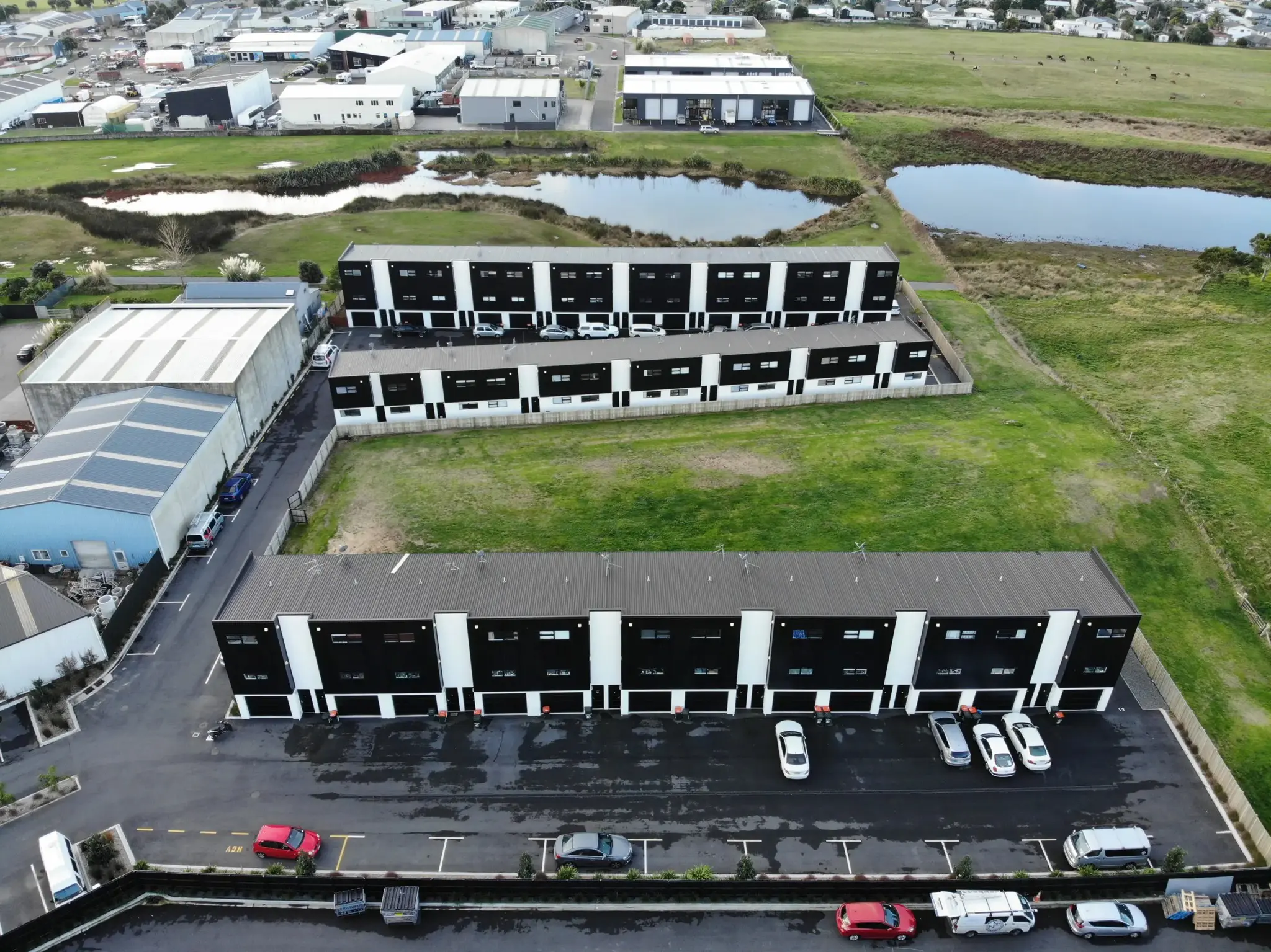 Metal cladding is being installed on a townhouse project.